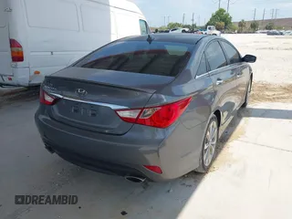 2014 Hyundai Sonata SE with VIN 5NPEC4AC4EH908832, listed as a IAAI auction lot 42099613 with 136,486 mi miles and . Bid and sale history available at DreamBid. Image 4.