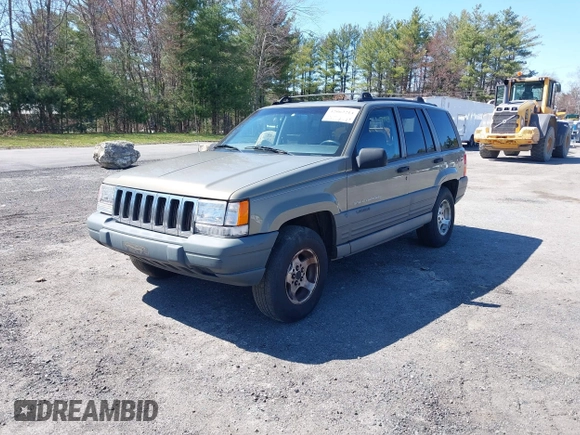 1997 Jeep Grand Cherokee Laredo with VIN 1J4GZ58S7VC713517, listed as a IAAI auction lot 42062214 with 205,533 mi miles. Bid and sale history available at carsss.com. Image 2.