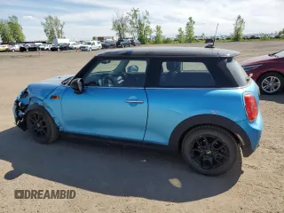 2017 MINI Hardtop Cooper with VIN WMWXP5C33H2G60921, listed as a Copart auction lot 58139295 with 94,599 mi miles and Salvage title. Bid and sale history available at DreamBid. Image 2.