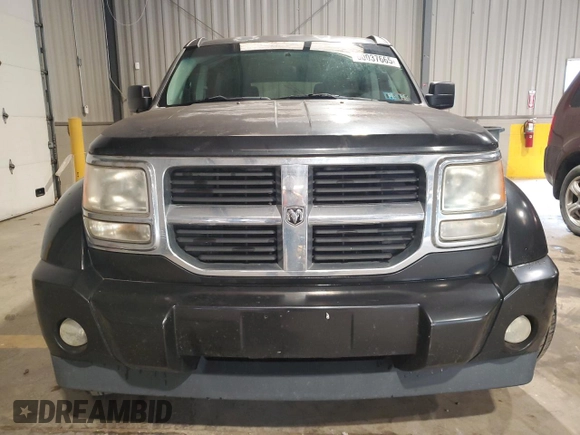 2008 Dodge Nitro SXT z VIN 1D8GT28K28W246131, wystawiony jako Copart lot #60037665 z przebiegiem 119 831 mil mil oraz Szkoda całkowita • Salvage title. Historia ofert i sprzedaży dostępna na DreamBid. Obrazek 5.