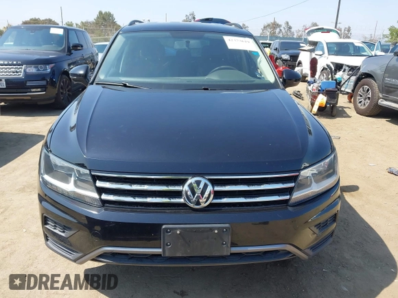 2018 Volkswagen Tiguan S with VIN 3VV1B7AX7JM092033, listed as a IAAI auction lot 42373619 with 124,775 mi miles and . Bid and sale history available at DreamBid. Image 12.