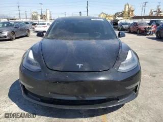 2021 Tesla Model 3 Standard Range Plus with VIN 5YJ3E1EAXMF069467, listed as a Copart auction lot 63273134 with 66,393 mi miles and Salvage Title. Bid and sale history available at carsss.com. Image 5.