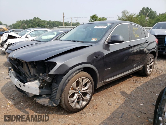 2015 BMW X4 xDrive28i with VIN 5UXXW3C55F0M87998, listed as a Copart auction lot 59693723 with 73,846 mi miles. Bid and sale history available at carsss.com. Image 1.