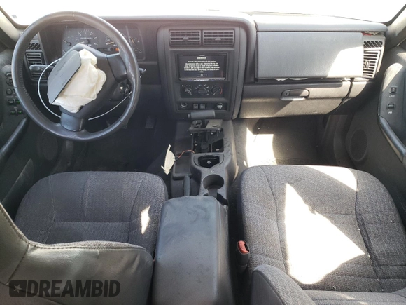 1999 Jeep Cherokee Sport with VIN 1J4FT68S9XL627003, listed as a Copart auction lot 49478595 with 320,444 mi miles and Salvage title. Bid and sale history available at DreamBid. Image 8.