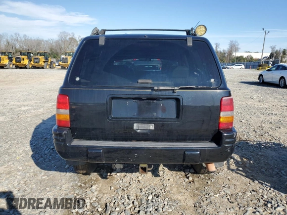 1997 Jeep Grand Cherokee Limited with VIN 1J4GZ78Y1VC598820, listed as a Copart auction lot 46398505 with 259,241 mi miles and Salvage Title. Bid and sale history available at carsss.com. Image 6.