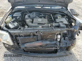 2015 Nissan Xterra Pro-4X z VIN 5N1AN0NWXFN664591, wystawiony jako Copart lot #60423525 z przebiegiem 246 477 mil mil oraz Szkoda całkowita • Salvage title. Historia ofert i sprzedaży dostępna na DreamBid. Obrazek 11.