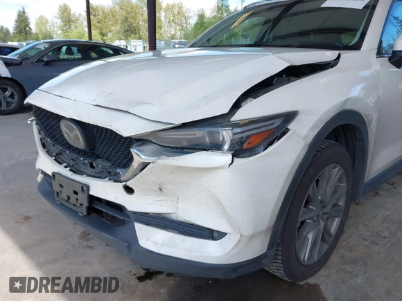 2020 Mazda CX-5 Grand Touring with VIN JM3KFBDM2L0863944, listed as a IAAI auction lot 42150805 with 63,932 mi miles and . Bid and sale history available at DreamBid. Image 6.