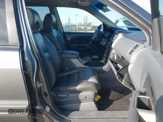 2007 Honda Pilot EX-L with VIN 5FNYF28797B001772, listed as a IAAI auction lot 41320270 with 220,227 mi miles. Bid and sale history available at carsss.com. Image 5.