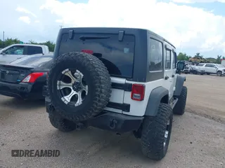 2011 Jeep Wrangler Unlimited Rubicon with VIN 1J4BA6H10BL536027, listed as a IAAI auction lot 42567901 with 164,487 mi miles and . Bid and sale history available at DreamBid. Image 4.