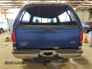 1999 Ford Super Duty F-250 XL with VIN 1FTNF21F2XEB09589, listed as a Copart auction lot 50700795 with 292,135 mi miles and Salvage Title. Bid and sale history available at carsss.com. Image 6.