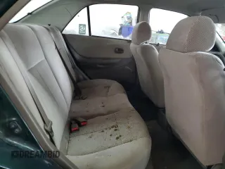 1999 Mazda Protege DX z VIN JM1BJ2220X0108600, wystawiony jako Copart lot #77004894 z przebiegiem 220 836 mil mil oraz Szkoda całkowita • Salvage title. Historia ofert i sprzedaży dostępna na DreamBid. Obrazek 10.