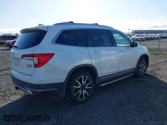 2021 Honda Pilot Touring 8-Passenger with VIN 5FNYF6H92MB031782, listed as a IAAI auction lot 42087322 with 70,062 mi miles and . Bid and sale history available at DreamBid. Image 4.