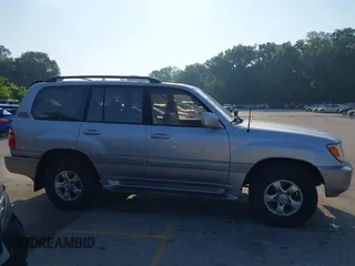 2001 Toyota Land Cruiser z VIN JTEHT05J912007249, wystawiony jako IAAI lot #42409963 z przebiegiem 303 292 mil mil oraz . Historia ofert i sprzedaży dostępna na DreamBid. Obrazek 13.