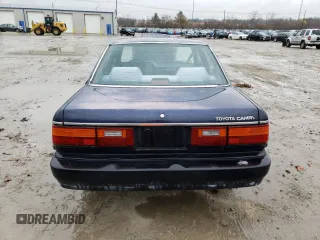 1989 Toyota Camry z VIN JT2SV21E6K3335385, wystawiony jako Copart lot #82466934 z przebiegiem 74 815 mil mil oraz Czysty tytuł • Clean title. Historia ofert i sprzedaży dostępna na DreamBid. Obrazek 6.