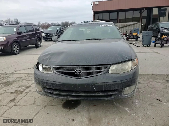 2000 Toyota Camry Solara SE with VIN 2T1CF22P5YC294384, listed as a Copart auction lot 82477634 with 267,469 mi miles and Salvage Title. Bid and sale history available at carsss.com. Image 11.