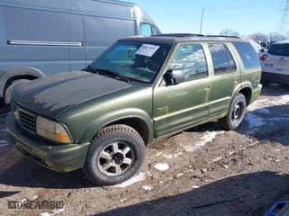 2001 Oldsmobile Bravada with VIN 1GHDT13W312184767, listed as a IAAI auction lot 41347993 with 130,306 mi miles. Bid and sale history available at carsss.com. Image 2.
