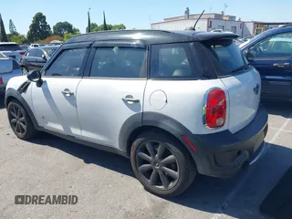 2012 MINI Countryman S with VIN WMWZC5C54CWM11869, listed as a IAAI auction lot 42265935 with 100,102 mi miles and . Bid and sale history available at DreamBid. Image 3.