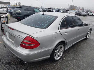 2003 Mercedes-Benz E-Class 5.5L AMG with VIN WDBUF76J93A351317, listed as a IAAI auction lot 41573446 with 144,119 mi miles. Bid and sale history available at carsss.com. Image 4.