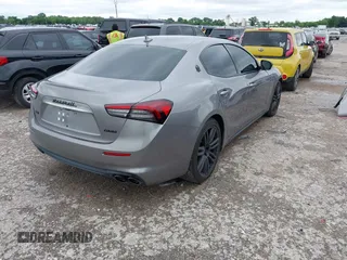 2021 Maserati Ghibli S Q4 with VIN ZAM57YTA8M1368703, listed as a IAAI auction lot 42170551 with 29,969 mi miles and . Bid and sale history available at DreamBid. Image 4.