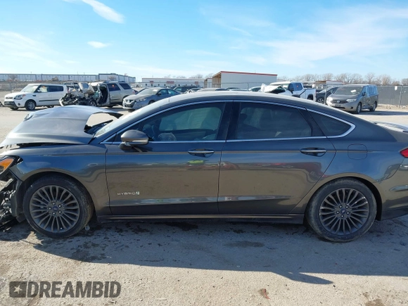 2017 Ford Fusion Hybrid Titanium z VIN 3FA6P0RU0HR314681, wystawiony jako IAAI lot #41288256 z przebiegiem 174 027 mil mil oraz . Historia ofert i sprzedaży dostępna na DreamBid. Obrazek 14.