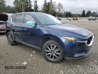 2018 Mazda CX-5 Touring with VIN JM3KFACM8J1349356, listed as a Copart auction lot 89154055 with 82,719 mi miles and Salvage Title. Bid and sale history available at carsss.com. Image 4.