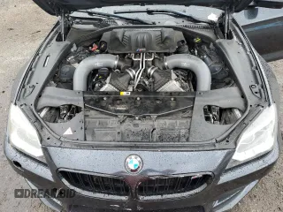 2015 BMW M6 z VIN WBS6C9C59FD467943, wystawiony jako Copart lot #63477904 z przebiegiem 80 186 mil mil oraz Szkody całkowita. Historia ofert i sprzedaży dostępna na DreamBid. Obrazek 11.