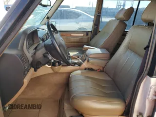 1995 Land Rover Range Rover with VIN SALHC1343SA656651, listed as a Copart auction lot 80172604 with 148,324 mi miles and Salvage title. Bid and sale history available at DreamBid. Image 7.