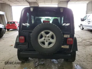 2002 Jeep Wrangler Sport with VIN 1J4FA49S62P713475, listed as a Copart auction lot 59299965 with 114,654 mi miles and Non repairable. Bid and sale history available at DreamBid. Image 6.