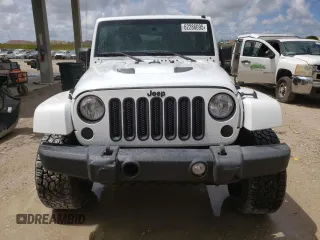 2015 Jeep Wrangler Unlimited Wrangler X with VIN 1C4BJWEG6FL614671, listed as a Copart auction lot 62286095 with 94,928 mi miles and Salvage title. Bid and sale history available at DreamBid. Image 5.