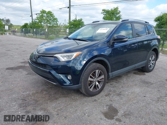 2018 Toyota RAV4 XLE with VIN JTMWFREV9JJ165655, listed as a IAAI auction lot 42138998 with 123,569 mi miles and . Bid and sale history available at carsss.com. Image 17.