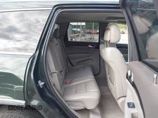 2011 Jeep Grand Cherokee 70th Anniversary with VIN 1J4RR4GG3BC631831, listed as a IAAI auction lot 42038415 with 130,811 mi miles. Bid and sale history available at carsss.com. Image 8.