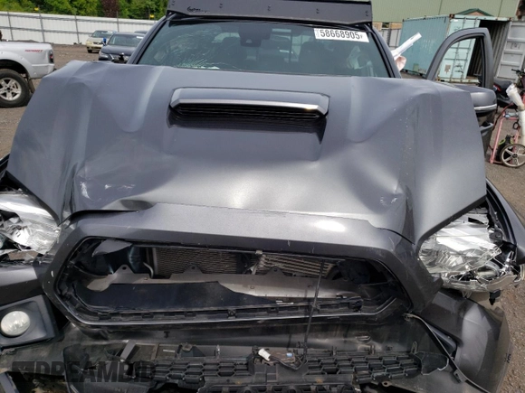 2019 Toyota Tacoma SR z VIN 3TMCZ5AN6KM283109, wystawiony jako Copart lot #58668905 z przebiegiem 44 923 mil mil oraz Szkoda całkowita • Salvage title. Historia ofert i sprzedaży dostępna na DreamBid. Obrazek 11.