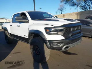 2023 Ram 1500 TRX with VIN 1C6SRFU95PN585088, listed as a IAAI auction lot 41304552 with 21,031 mi miles. Bid and sale history available at carsss.com. Image 1.