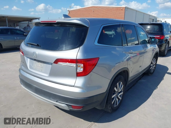 2020 Honda Pilot EX-L with VIN 5FNYF5H46LB004744, listed as a IAAI auction lot 42095298 with 76,159 mi miles and . Bid and sale history available at DreamBid. Image 4.