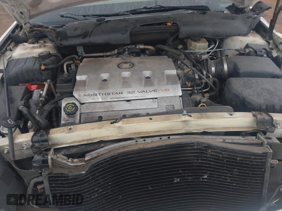 2002 Cadillac DeVille DHS z VIN 1G6KE57YX2U212020, wystawiony jako IAAI lot #41287342 z przebiegiem Nie podano mil oraz . Historia ofert i sprzedaży dostępna na DreamBid. Obrazek 10.