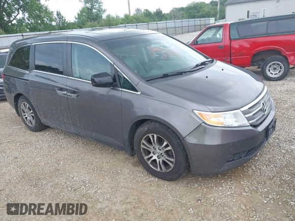 2012 Honda Odyssey EX-L with VIN 5FNRL5H60CB054277, listed as a IAAI auction lot 42459861 with 205,722 mi miles and . Bid and sale history available at DreamBid. Image 1.
