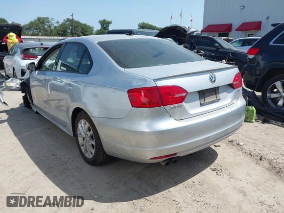 2012 Volkswagen Jetta SE with VIN 3VWBP7AJXCM340937, listed as a IAAI auction lot 42526373 with 157,113 mi miles and . Bid and sale history available at DreamBid. Image 3.