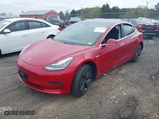 2018 Tesla Model 3 Long Range Battery with VIN 5YJ3E1EA8JF030677, listed as a IAAI auction lot 41989347 with 69,674 mi miles. Bid and sale history available at carsss.com. Image 19.