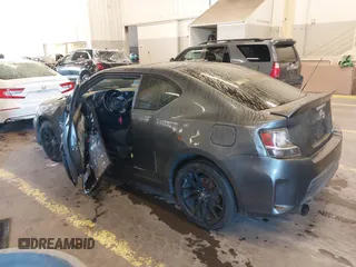 2014 Scion tC with VIN JTKJF5C77E3069906, listed as a IAAI auction lot 41243445 with 128,791 mi miles. Bid and sale history available at carsss.com. Image 3.