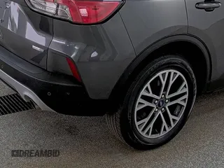 2020 Ford Escape SEL z VIN 1FMCU9H60LUB11753, wystawiony jako IAAI lot #42516624 z przebiegiem 75 781 mil mil oraz . Historia ofert i sprzedaży dostępna na DreamBid. Obrazek 1.