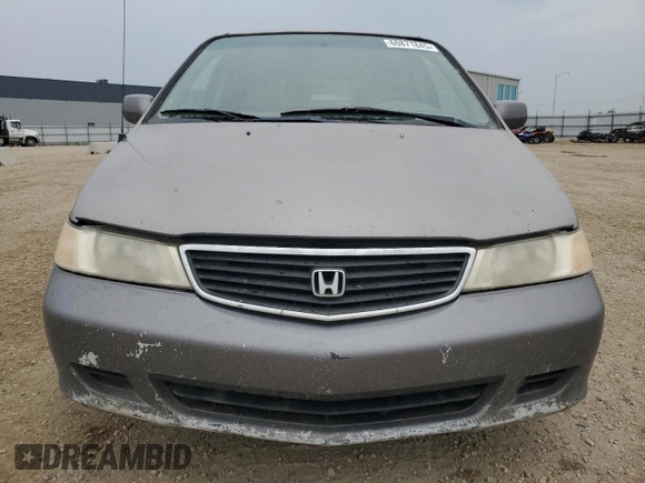 2000 Honda Odyssey EX z VIN 2HKRL186XYH010384, wystawiony jako Copart lot #60871845 z przebiegiem 423 167 mil mil oraz Czysty tytuł • Clean title. Historia ofert i sprzedaży dostępna na DreamBid. Obrazek 5.