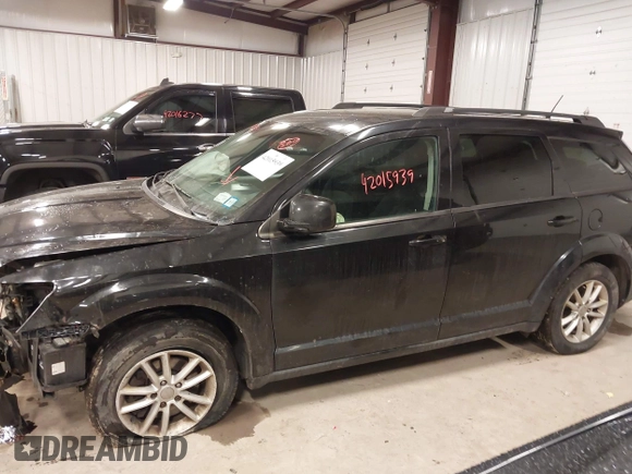 2013 Dodge Journey SXT with VIN 3C4PDDBGXDT571489, listed as a IAAI auction lot 42015939 with 206,550 mi miles and . Bid and sale history available at DreamBid. Image 14.