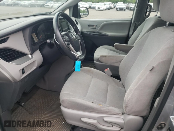 2015 Toyota Sienna L with VIN 5TDZK3DCXFS620092, listed as a Copart auction lot 61606095 with 130,624 mi miles and Salvage title. Bid and sale history available at DreamBid. Image 7.