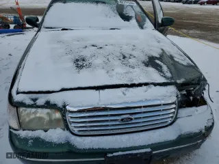 2000 Ford Crown Victoria with VIN 2FAFP73WXYX157746, listed as a Copart auction lot 82748804 with 56,820 mi miles and Salvage Title. Bid and sale history available at carsss.com. Image 11.