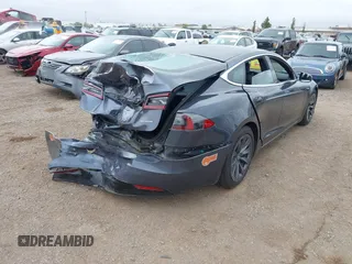 2020 Tesla Model S Long Range with VIN 5YJSA1E29LF363957, listed as a IAAI auction lot 42402667 with 45,058 mi miles and . Bid and sale history available at DreamBid. Image 4.