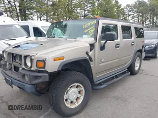 2003 Hummer H2 with VIN 5GRGN23U73H142389, listed as a IAAI auction lot 42219627 with 78,547 mi miles. Bid and sale history available at carsss.com. Image 18.