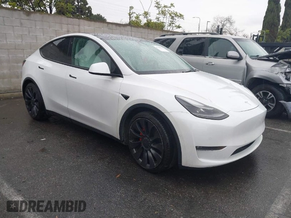2021 Tesla Model Y Performance with VIN 5YJYGDEF2MF230374, listed as a IAAI auction lot 41708828 with 20,272 mi miles. Bid and sale history available at carsss.com. Image 1.