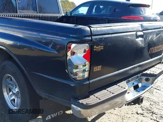 1998 Mazda B-Series 2WD Truck SX with VIN 4F4YR12C4WTM47743, listed as a IAAI auction lot 41430832 with 318,909 mi miles. Bid and sale history available at carsss.com. Image 19.