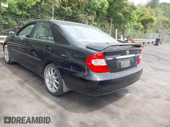 2003 Toyota Camry LE with VIN JTDBF32K430146557, listed as a IAAI auction lot 42102454 with 179,653 mi miles. Bid and sale history available at carsss.com. Image 3.