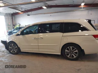 2015 Honda Odyssey Touring Elite with VIN 5FNRL5H97FB060060, listed as a IAAI auction lot 41829864 with Not Provided miles and . Bid and sale history available at DreamBid. Image 13.